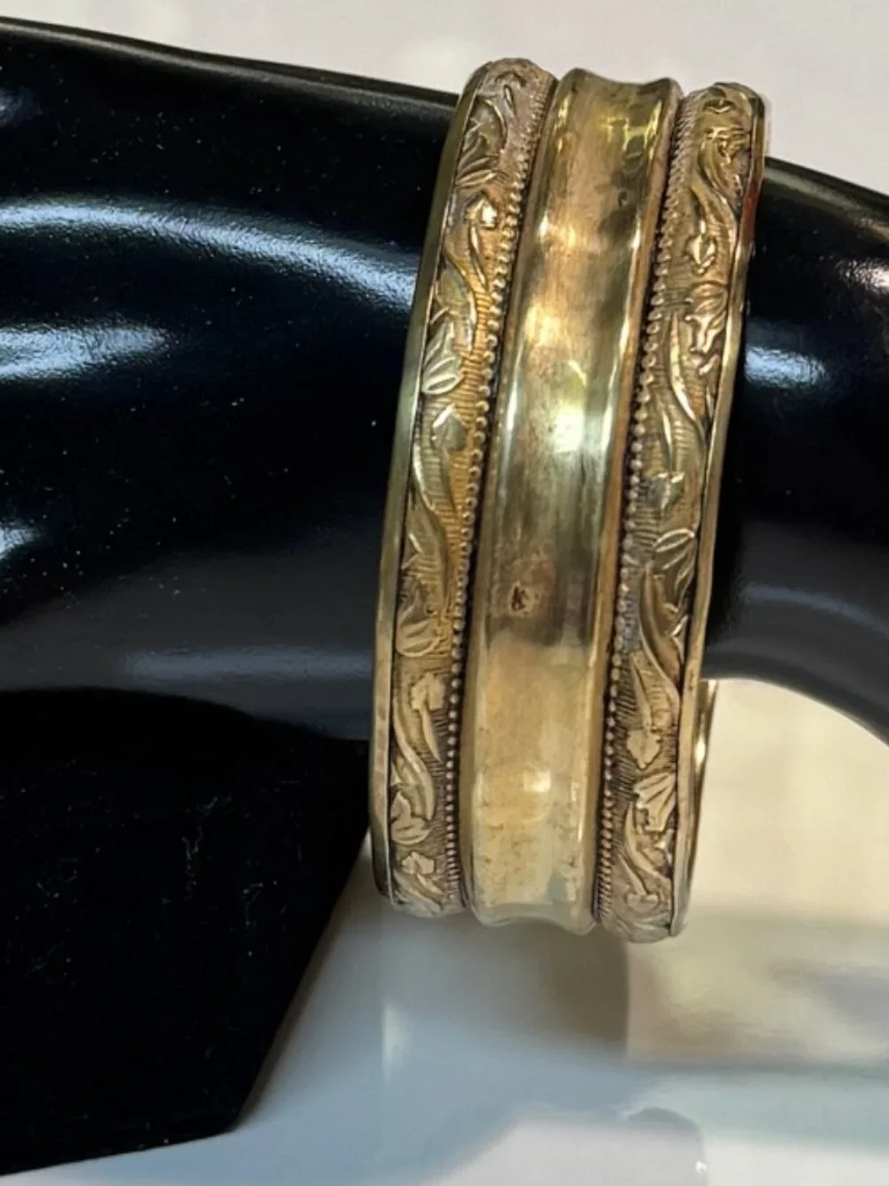 Gold Tone (not sure if brass) bangle bracelet